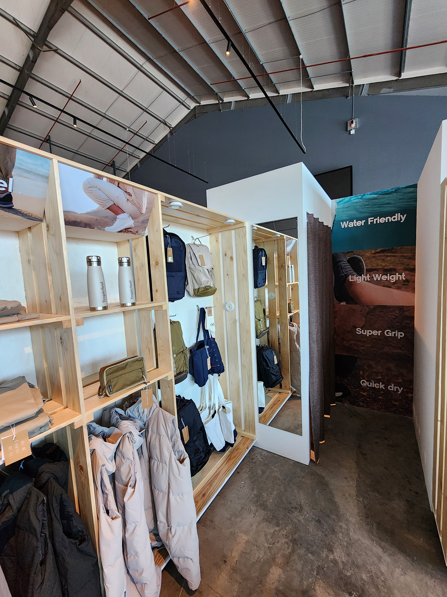 Evolution Scenic painted MDF fitting rooms with curtains and customer mirrors.