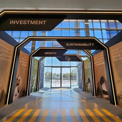 Evolution Scenic custom arrival arch with integrated dynamic content at Abu Dhabi Energy Centre.