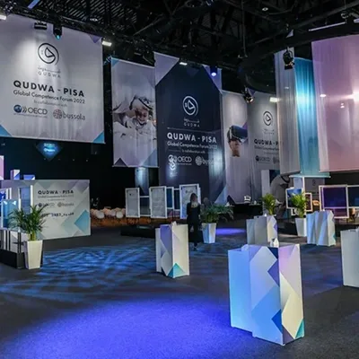 Evolution Scenic modular Qudwa–PISA forum environment combining the stage, Media Hub and branded scenic elements.