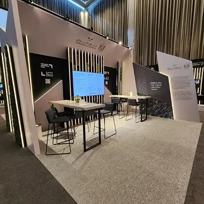 Evolution Scenic metal-framed MDF structure supporting integrated screens and angular scenic cladding.
