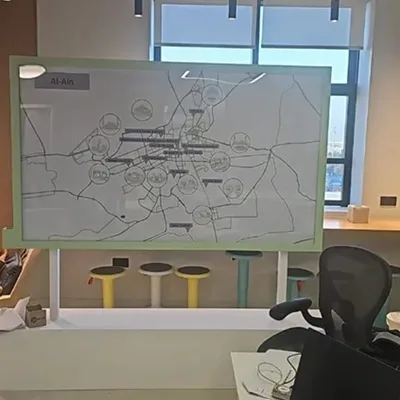 Clear-acrylic AD Map Wall slotted into a light-green painted scenic border.
