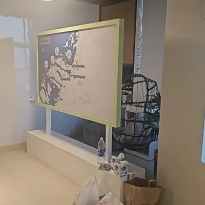Interactive Abu Dhabi map display combining clear acrylic, paint and printed vinyl.