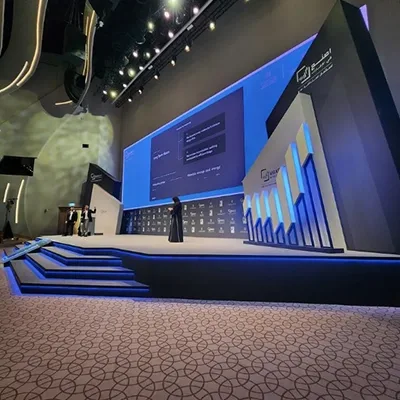 Custom scenic architecture surrounding the venue screen within the main stage composition.