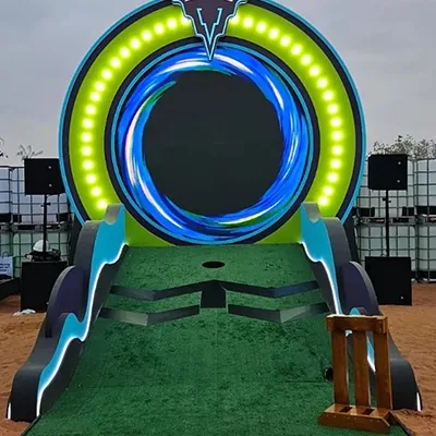 Custom putting ramp leading through a colour-changing circular scenic light feature.