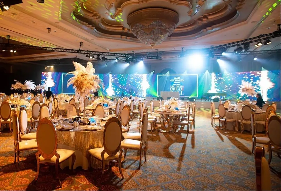 Custom scenic stage creating a clear focal point across the main ballroom.
