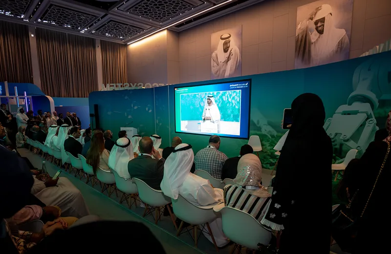 Gasha interaction area with varied-height scenic walls and integrated display technology.