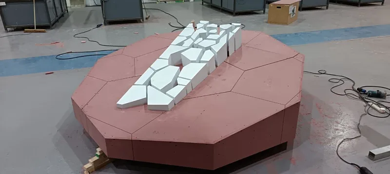 Precision fabricated geometric panels creating the three-dimensional KSA Pavilion identity.