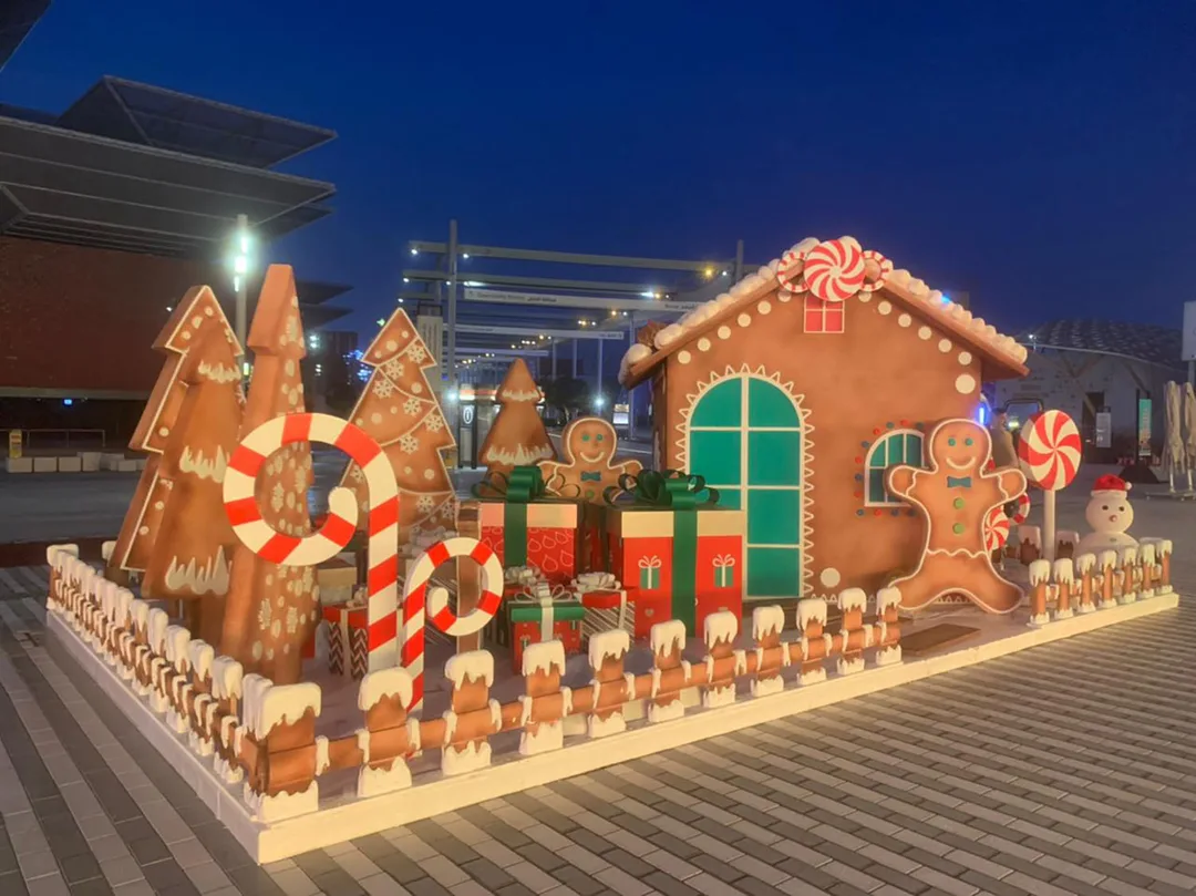 Expo Winter City gingerbread house scenery with painted icing and green window details