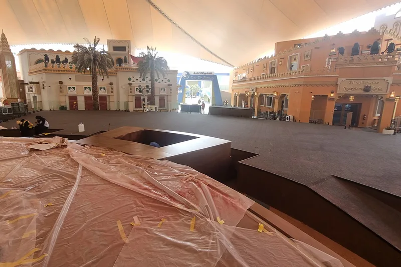 Temporary scenic structure installed over protected venue flooring without permanent fixings
