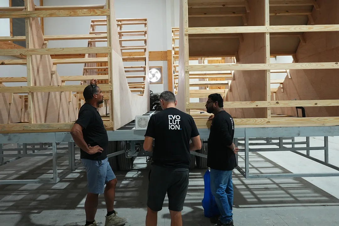 Creative and technical teams reviewing scenic assembly during workshop dry-fit
