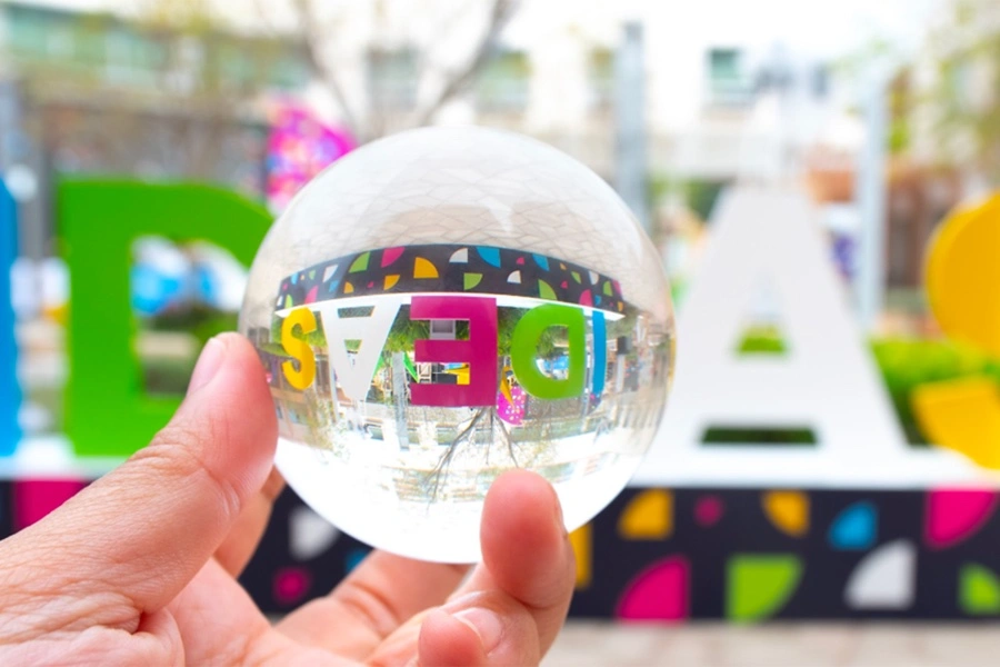 Custom acrylic and graphic details integrated into geometric scenic display structures.