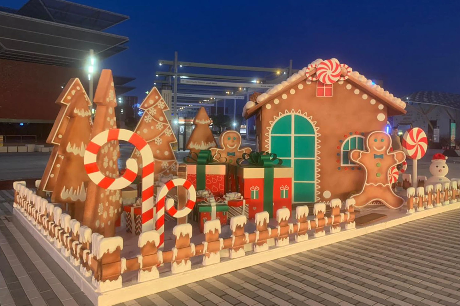 Expo Winter City gingerbread house scenery with painted icing and green window details