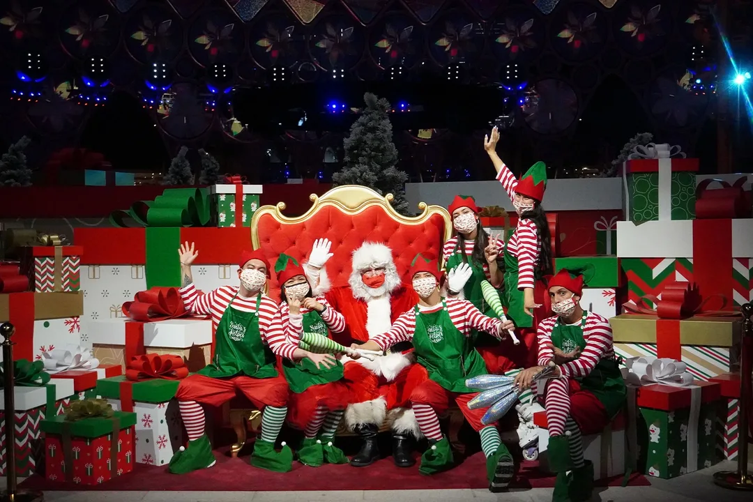Refurbished Santa letter station surrounded by timber gift boxes and festive scenic props.