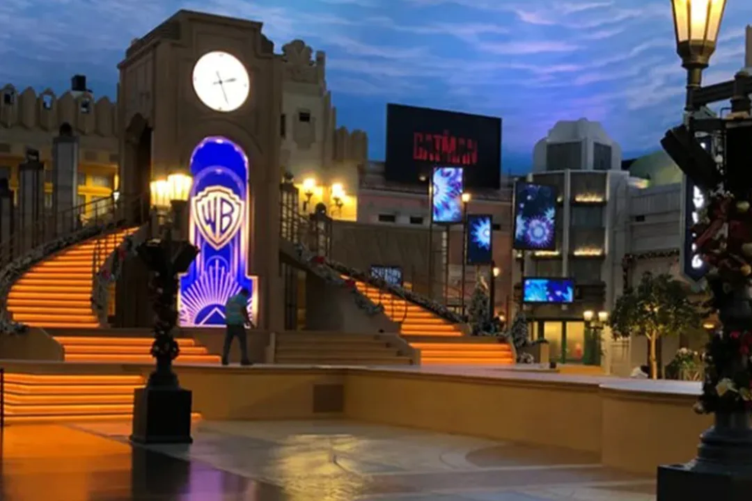 Evolution Scenic illuminated Art Deco stage with clock tower, staircases and integrated video displays.