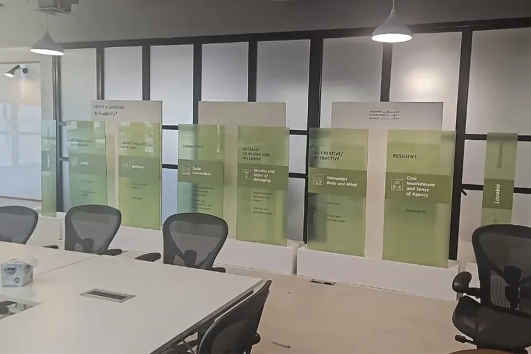 Coordinated ADEO scenic installation combining MDF walls, acrylic displays and printed graphics.