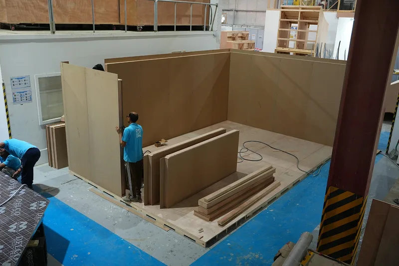 Modular scenic wall sections labelled for sequence, handling and reassembly inside a constrained venue.