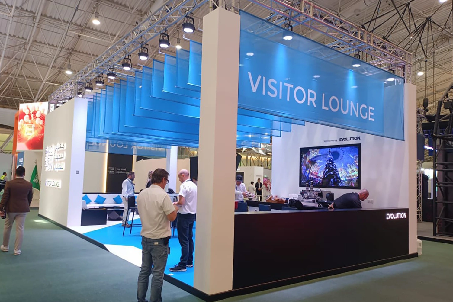 Evolution Scenic modular SES Exhibition Lounge with suspended blue fabric ceiling in Riyadh.