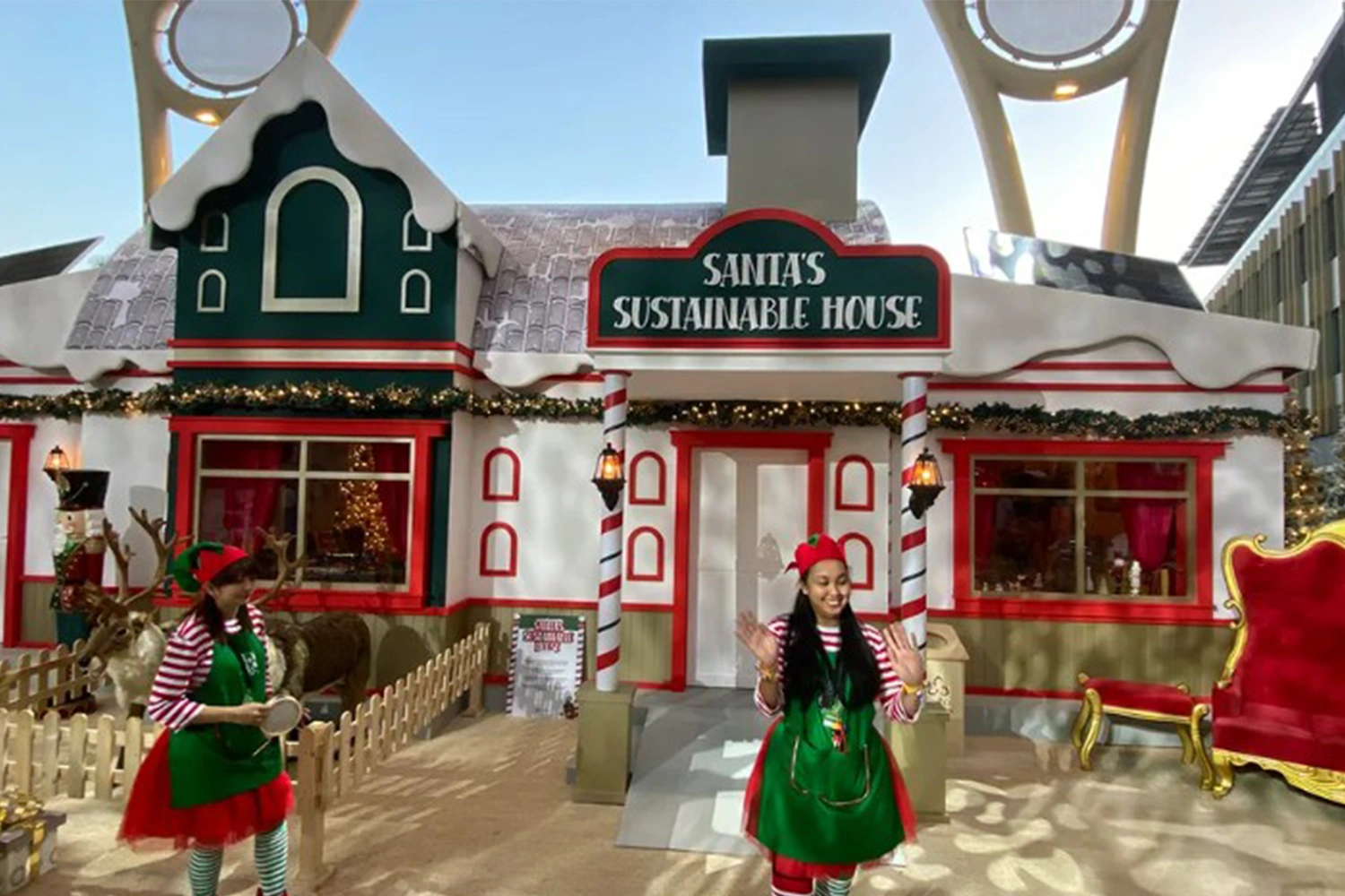 Custom Santa throne setting surrounded by oversized presents and snow-dressed festive scenery.