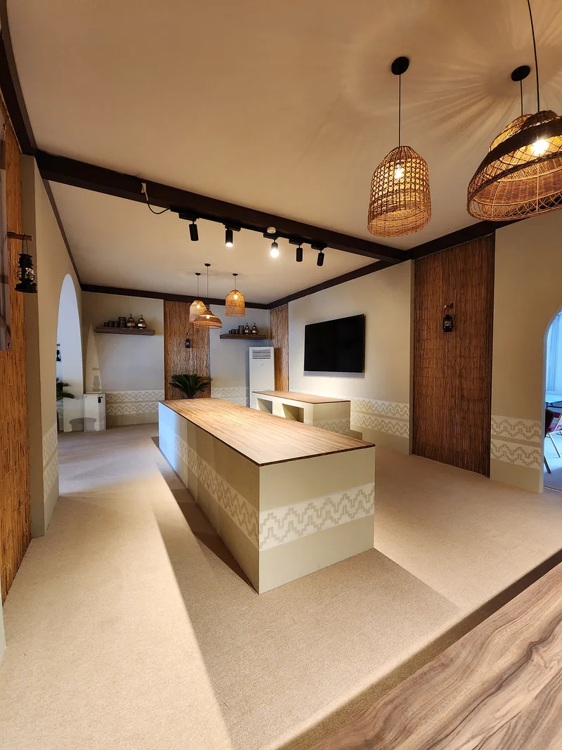 Three custom buffet counters integrated within the carpeted hospitality tent interior.