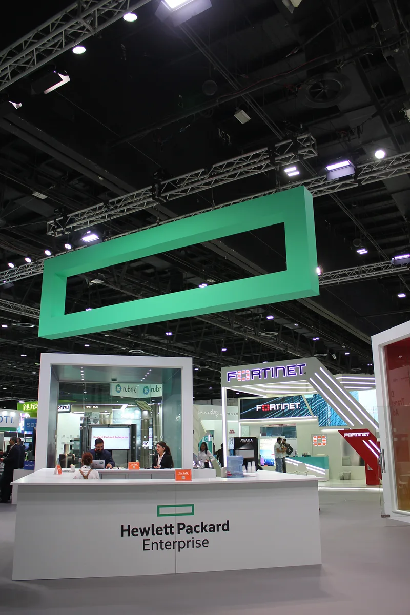 Evolution Scenic fabricated green overhead rectangular feature above the HPE GITEX exhibition stand.