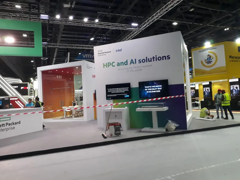 Painted MDF scenic construction and vinyl graphics across the HPE GITEX exhibition stand.