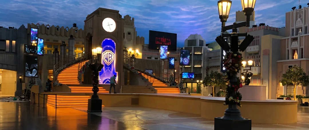 Evolution Scenic illuminated Art Deco stage with clock tower, staircases and integrated video displays.