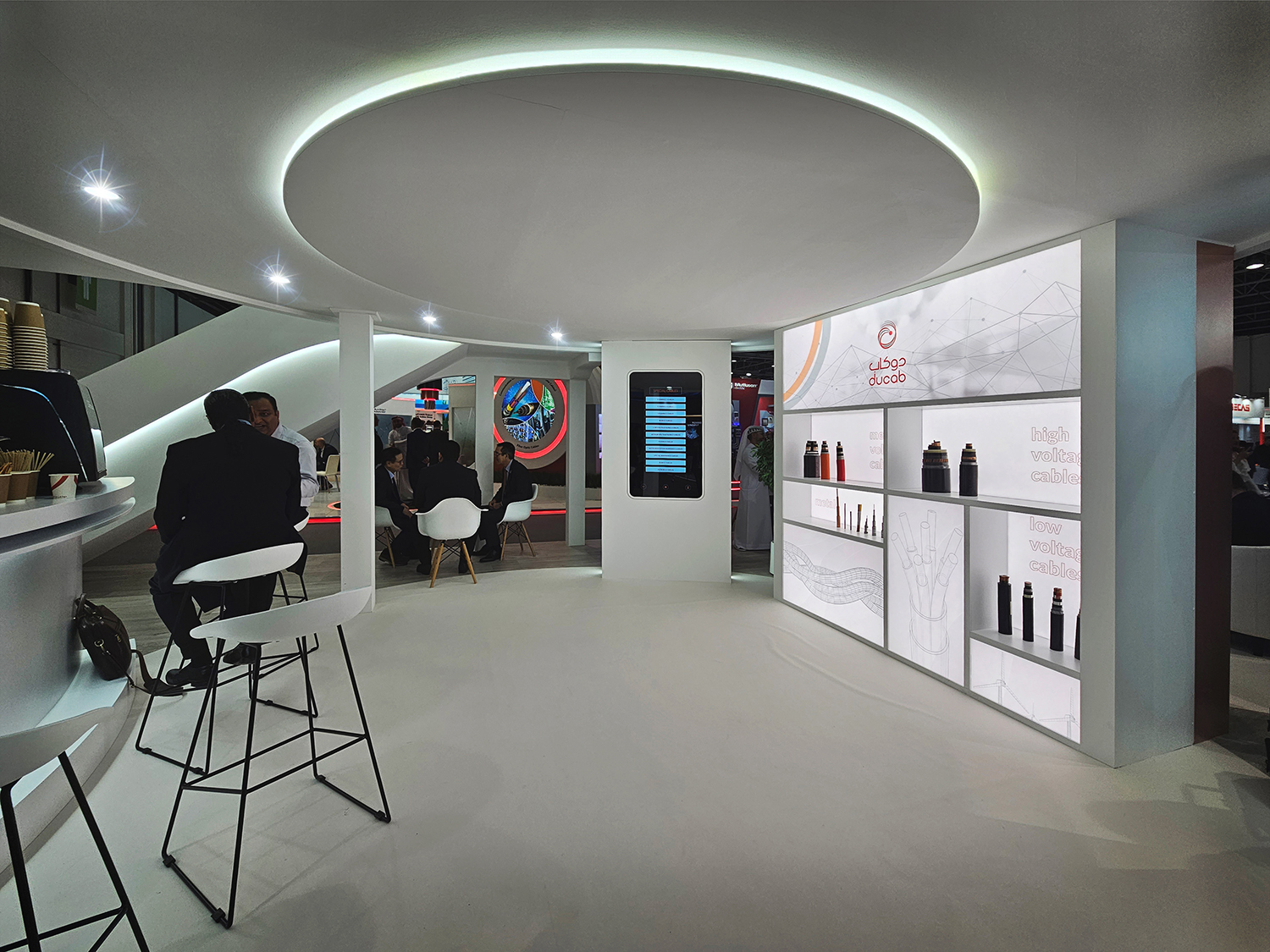 Fire-retardant MDF product wall with illuminated glass shelves and acrylic graphic panels.