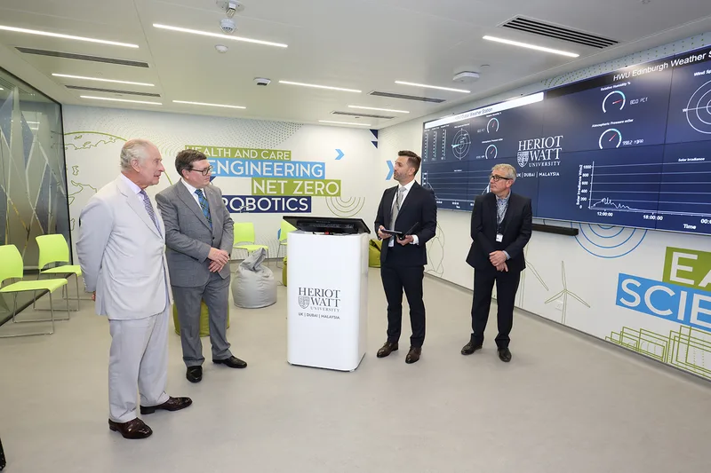 Evolution Scenic branded wall graphics surrounding integrated display screens at Heriot-Watt Climate Hub Dubai.