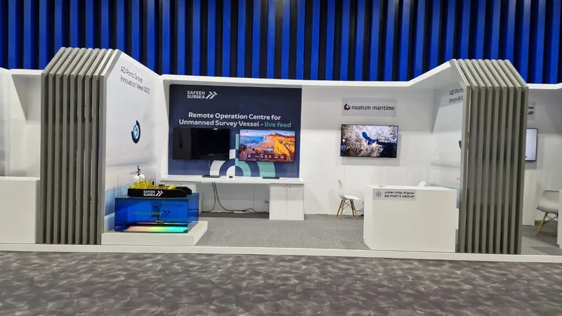 Custom booth wall with concealed cable-management access behind the mounted LED screen.