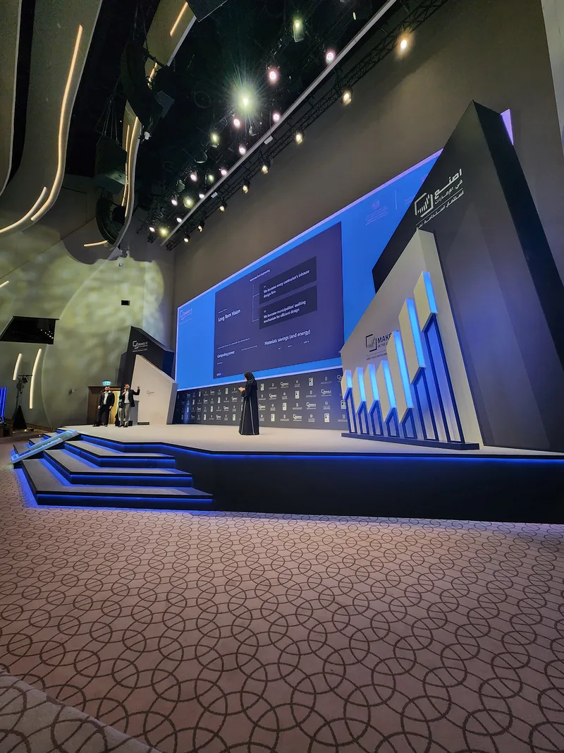 Custom scenic architecture surrounding the venue screen within the main stage composition.