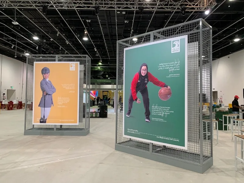 Scenic gallery framework combining steel mesh construction with externally supplied graphics.