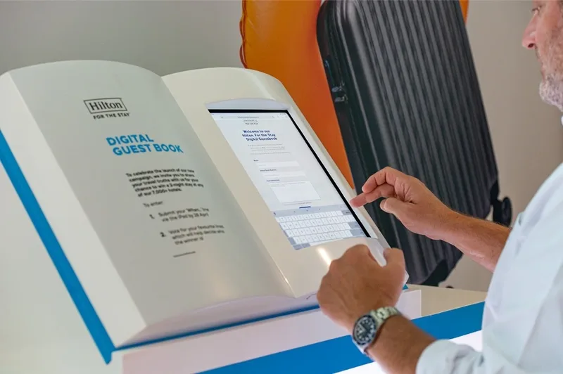 Touchscreen engagement kiosk within hospitality activation