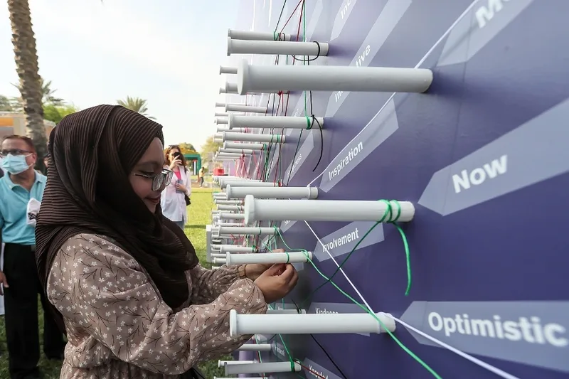 Interactive thread-wall installation fabricated by Evolution Scenic for the Abu Dhabi activation.