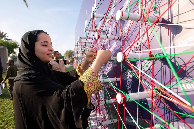 Interactive thread-wall installation fabricated by Evolution Scenic for the Abu Dhabi activation.