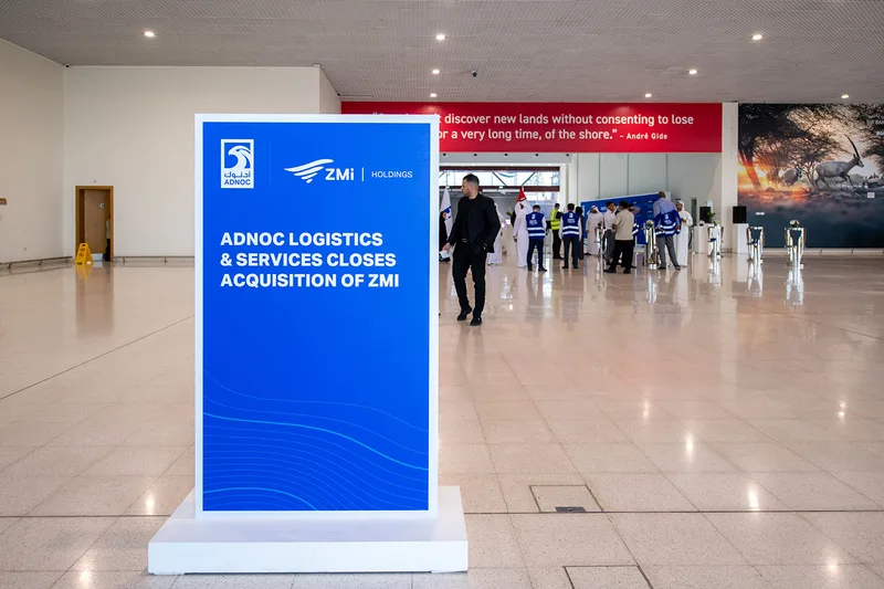 Evolution Scenic branded totem display positioned within the interior reception route.