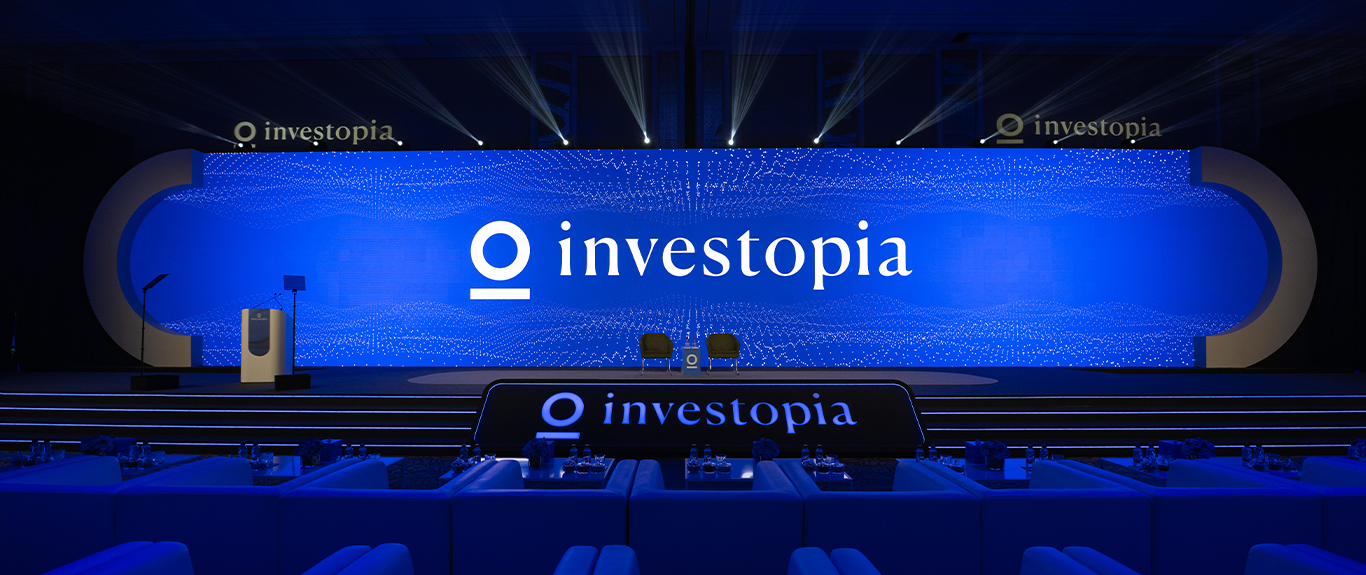 Evolution Scenic’s 30-metre Investopia main stage with curved scenic structures and integrated LED screens.