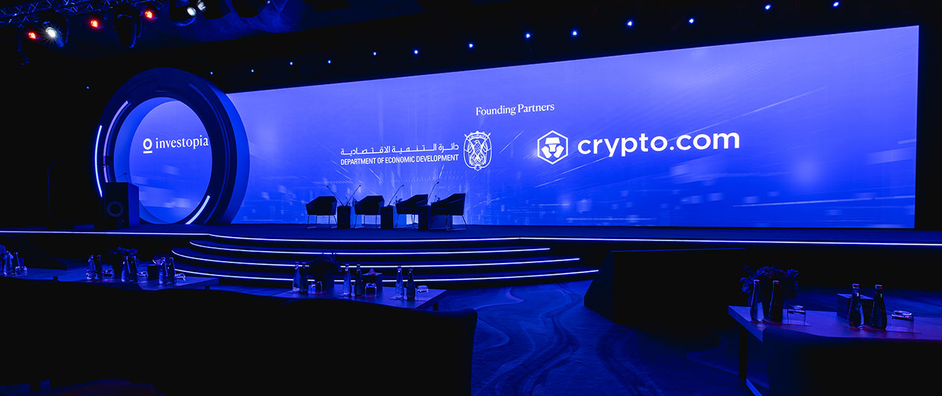 Evolution Scenic 21-metre Investopia main stage with illuminated circular scenic centrepiece.