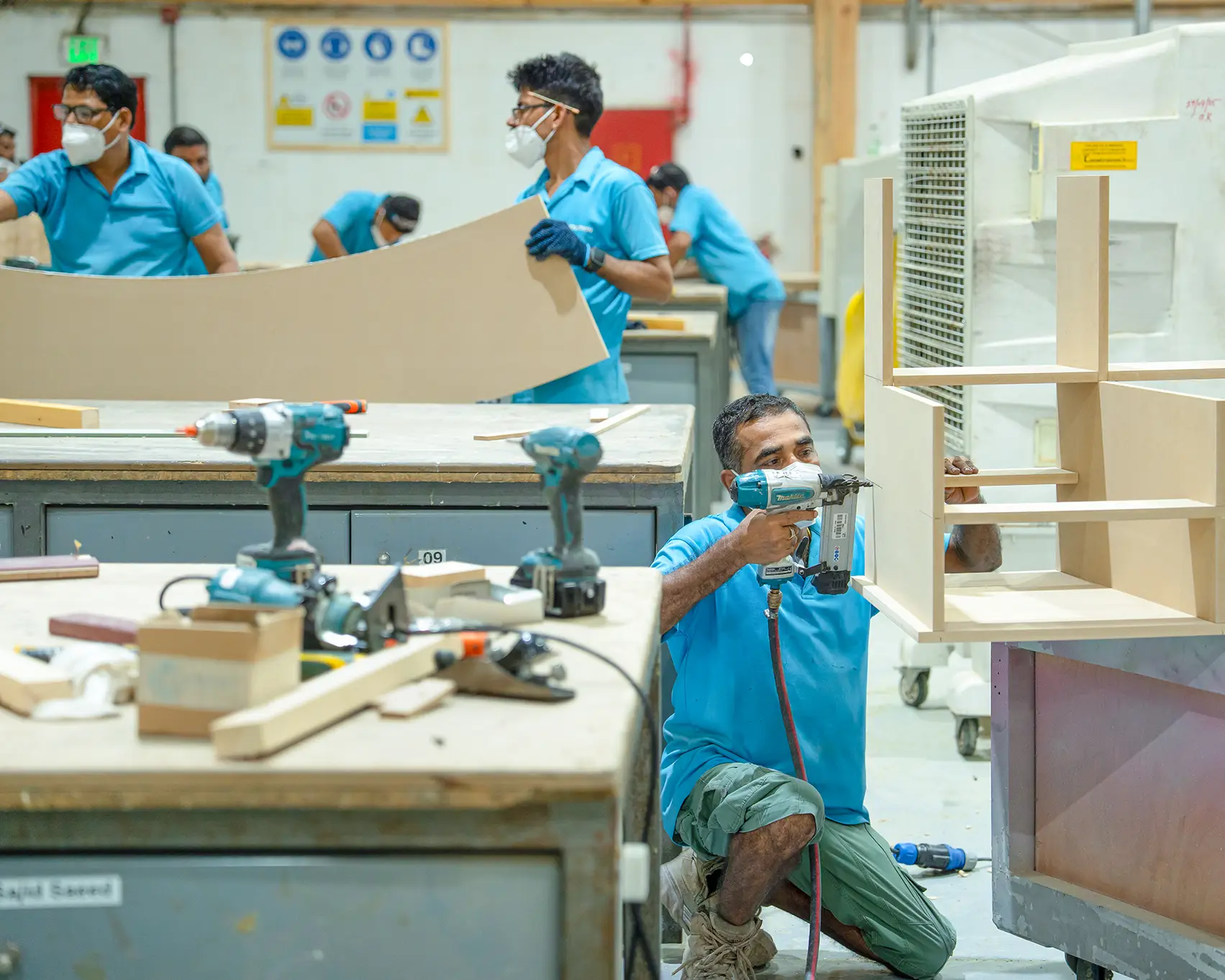 Evolution Scenic workshop coordinating machining, assembly, finishing and packing.
