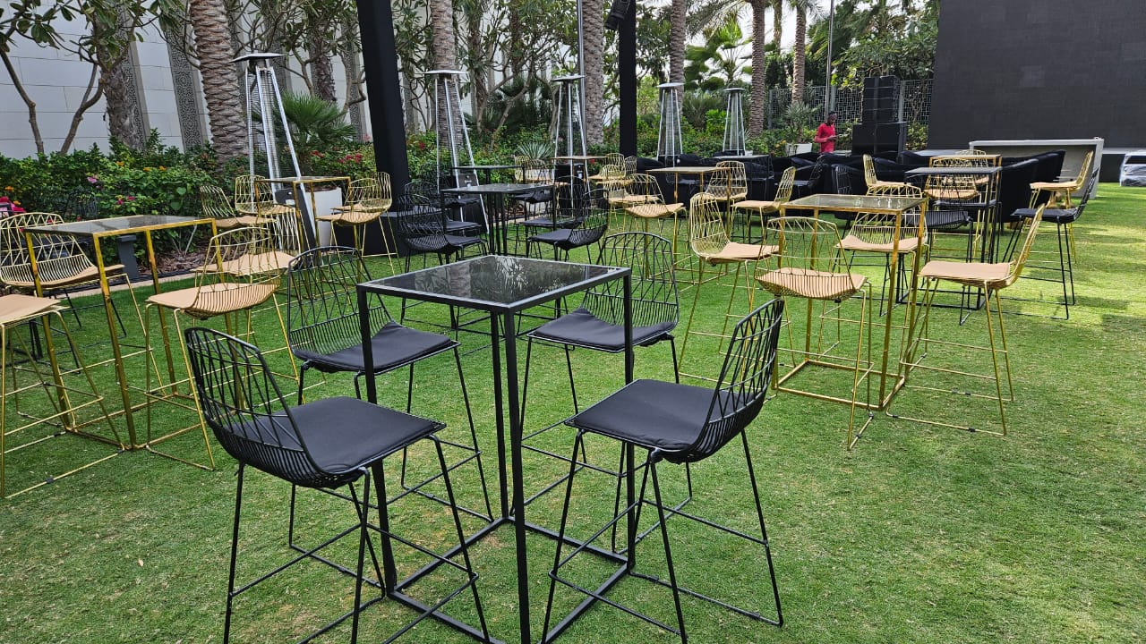 Coordinated black and gold scenic joinery linking registration and entertainment areas.
