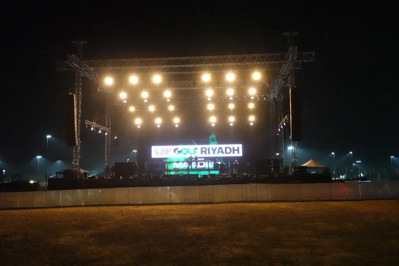 LIV Golf Riyadh 2025 main stage with truss structure, event lighting and illuminated branding.