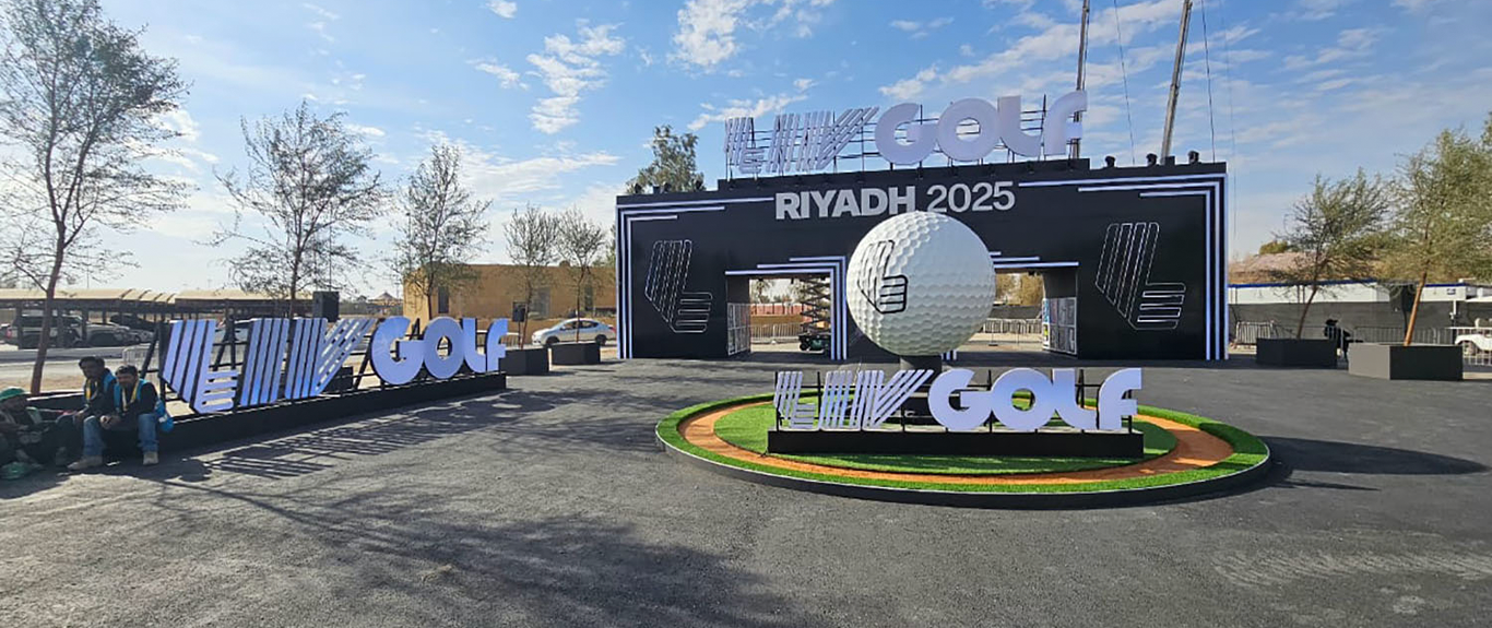 Daytime view of the scenic entrance portal and circular rotating golf-ball feature.