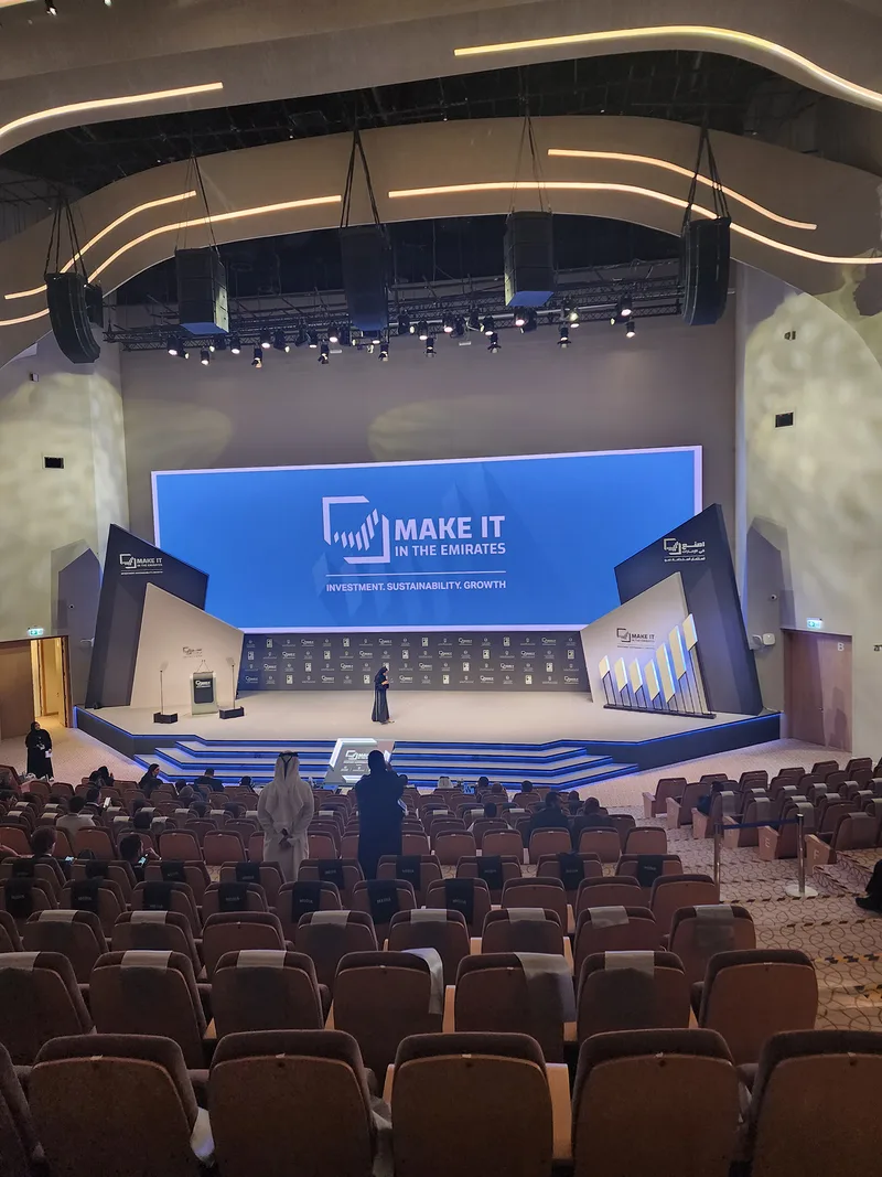 Evolution Scenic angular main stage with integrated screen and illuminated detailing in Abu Dhabi.