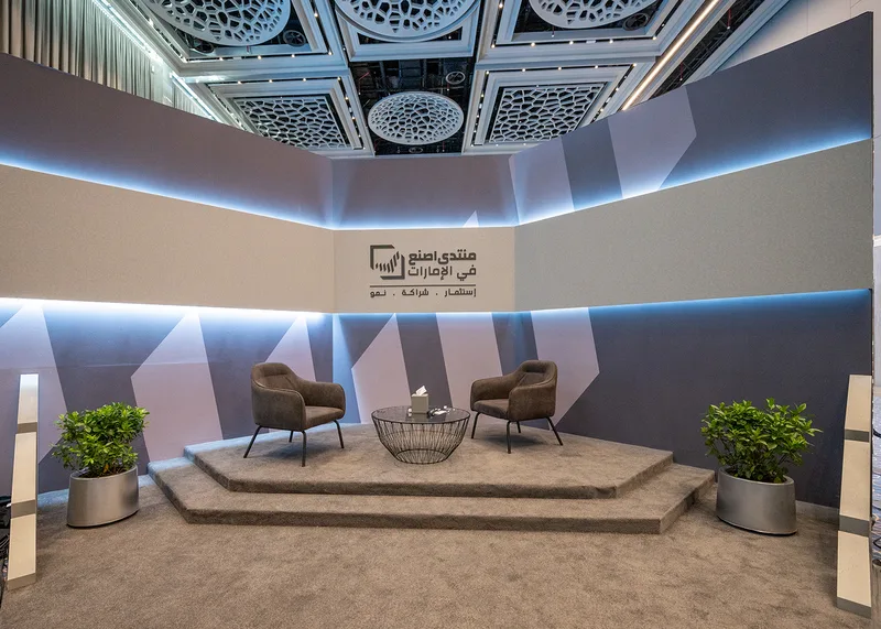 Evolution Scenic fabricated meeting area with angular scenic walls and branded graphics