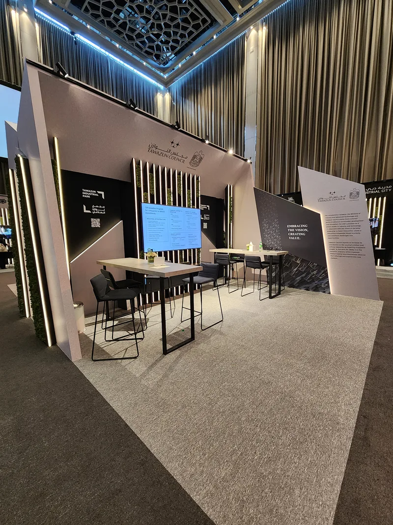 Evolution Scenic metal-framed MDF structure supporting integrated screens and angular scenic cladding.