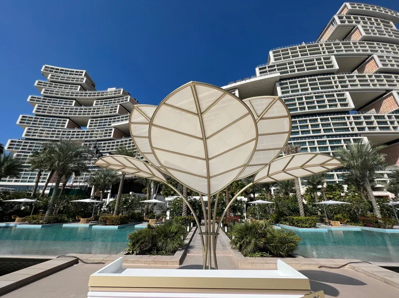 Evolution Scenic metalwork supporting sculptural leaf forms at Atlantis The Royal. Painted scenic surfaces and graphic detailing across the custom fabricated installation.