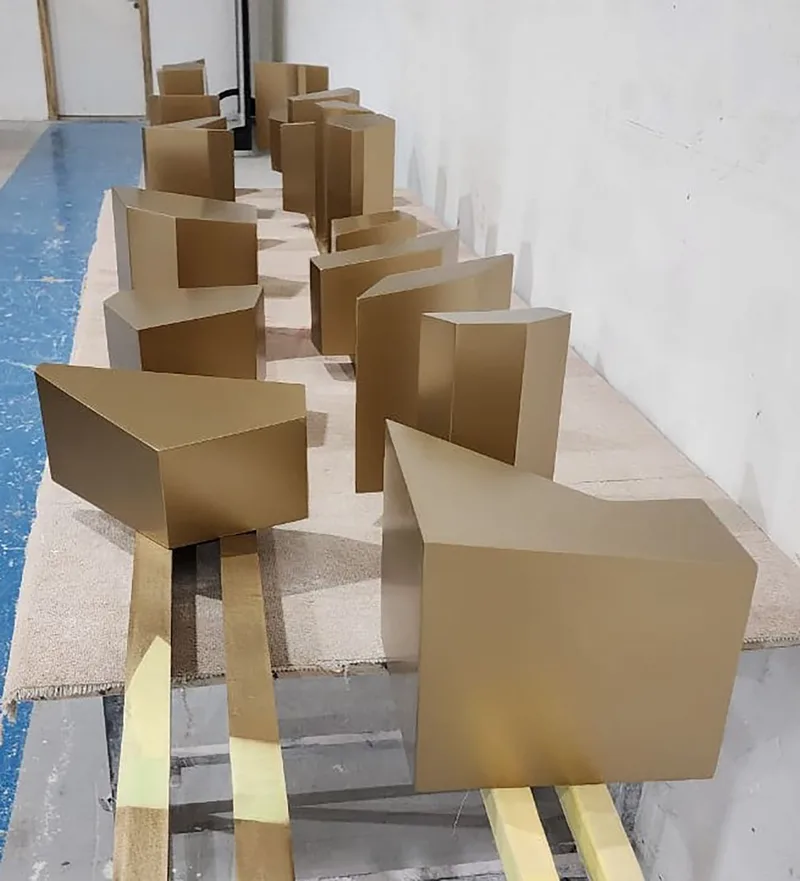 Evolution Scenic specialist scenic finishing applied to bronze and gold fabricated surfaces.
