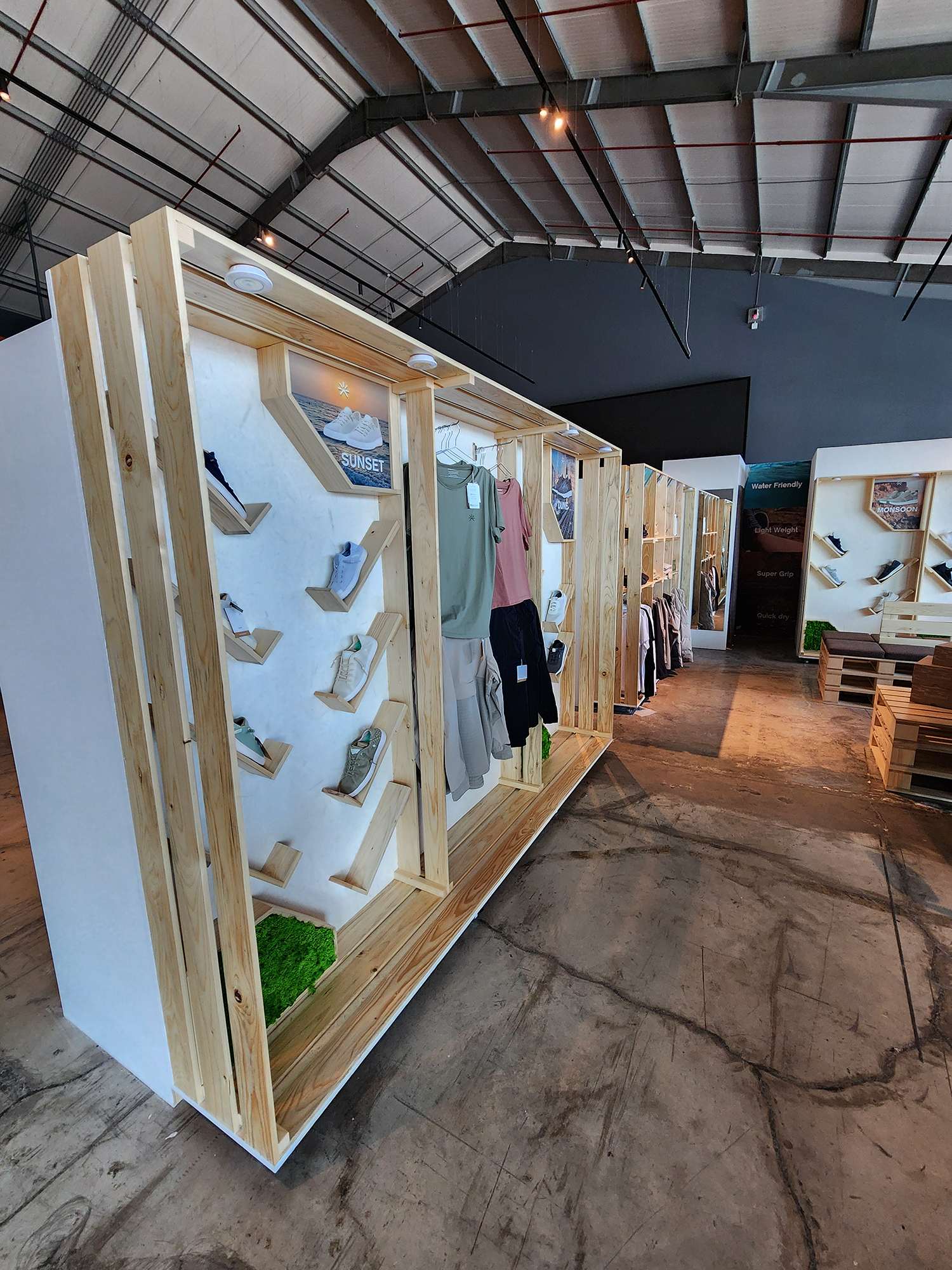 Mixed-material display structure combining white wood, PSB board and branded graphics.