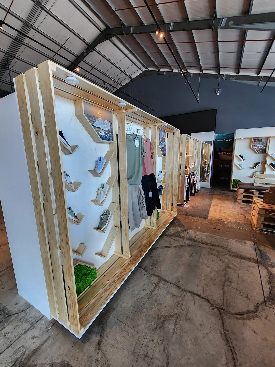 Mixed-material display structure combining white wood, PSB board and branded graphics.
