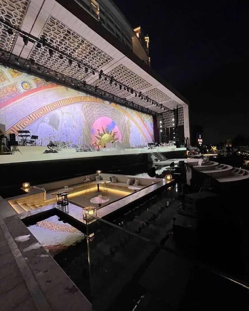 Scenic metalwork, graphics and textiles combined across the temporary branded environment.