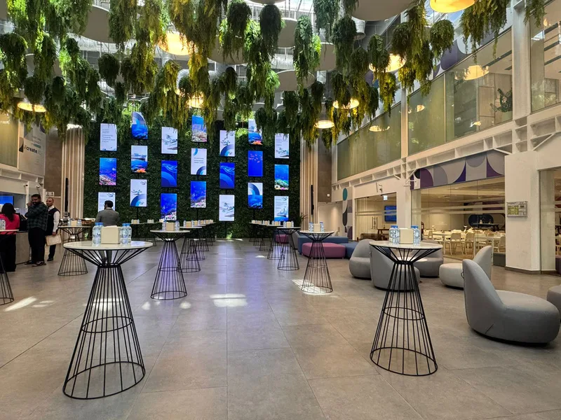 Evolution Scenic modular branding panels creating coordinated messaging across the temporary environment.
